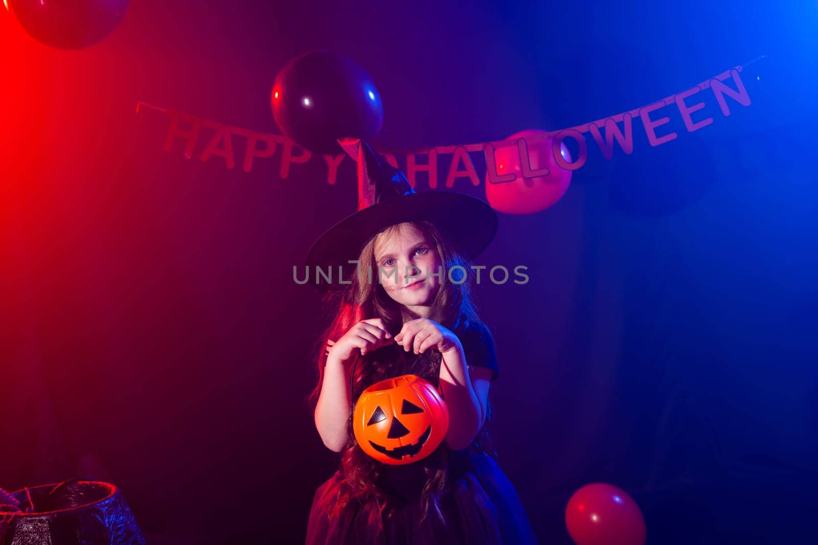 Funny child girl in witch costume for Halloween with pumpkin Jack. by Satura86