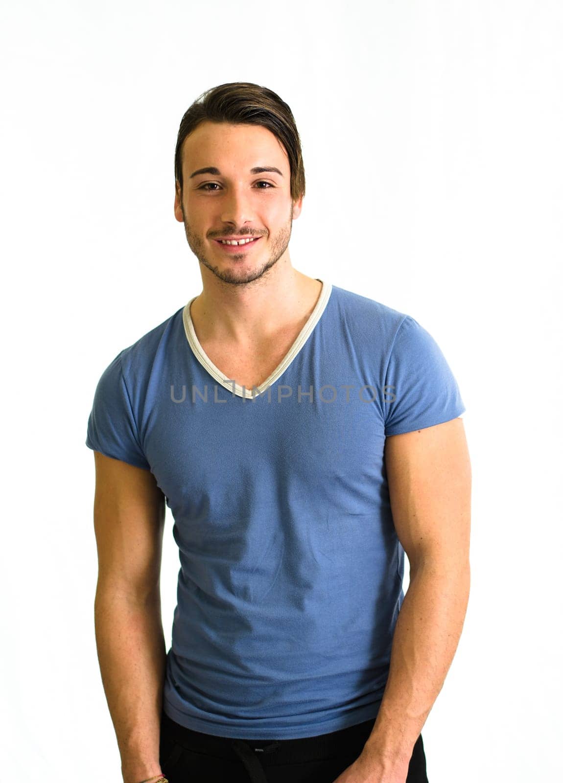 Smiling and cute young man, muscular build, isolated on white background