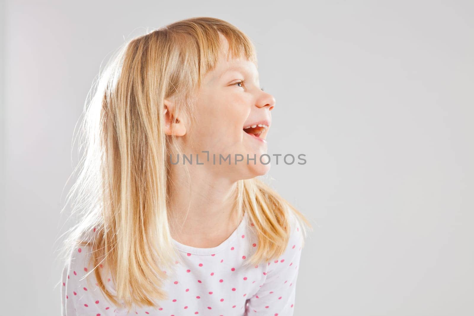Studio portrait of happy smiling young girl
