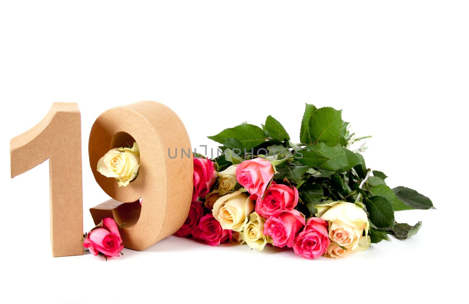 Number of age in a colorful studiosetting,surrounded with roses