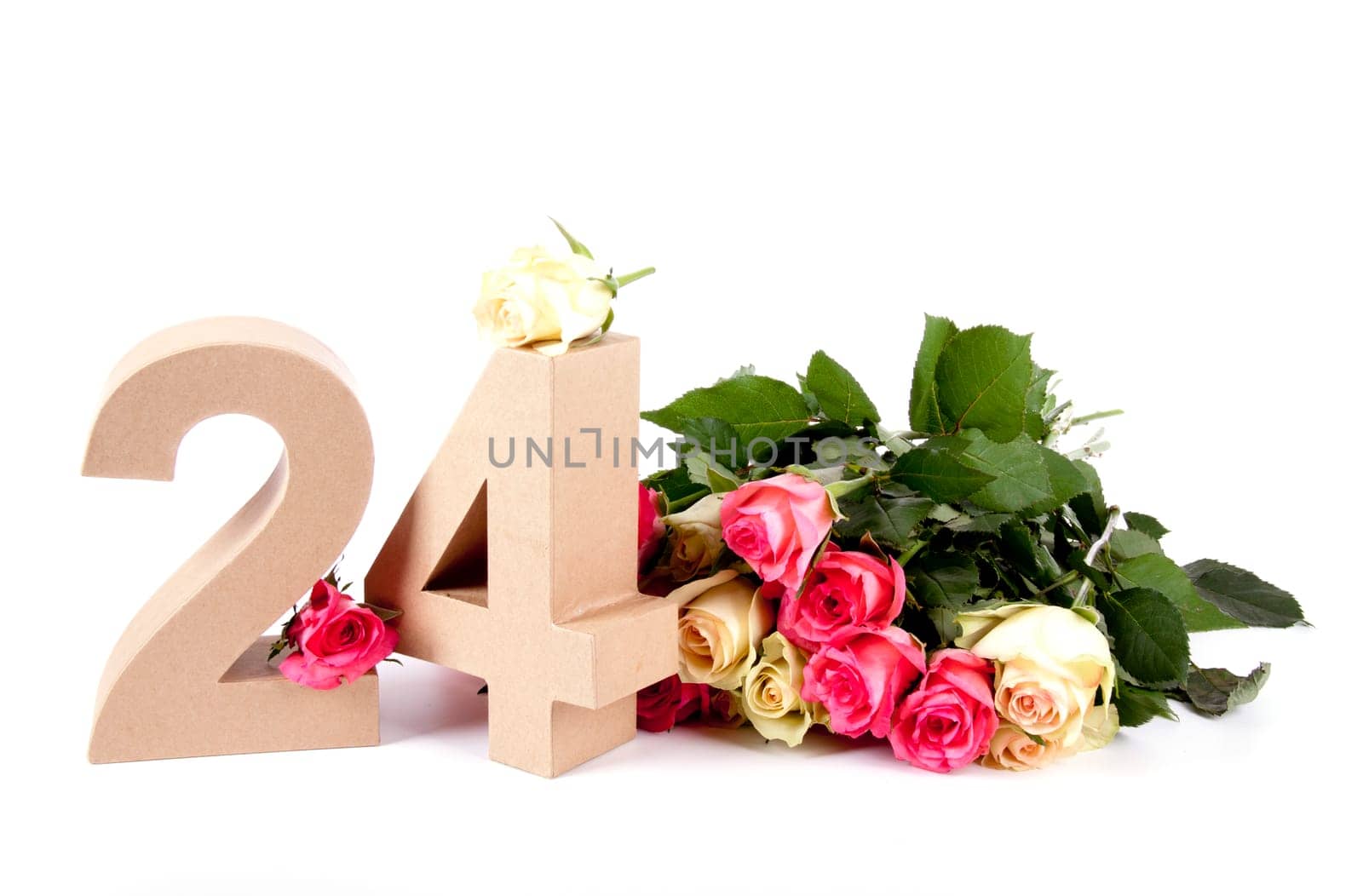 Number of age in a colorful studiosetting,surrounded with roses