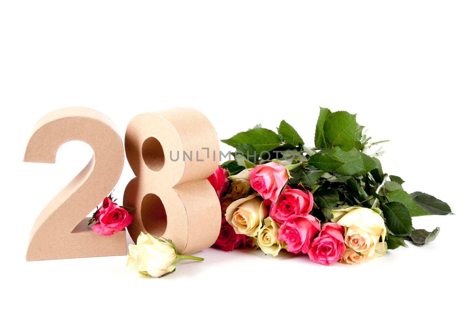 Number of age in a colorful studiosetting,surrounded with roses