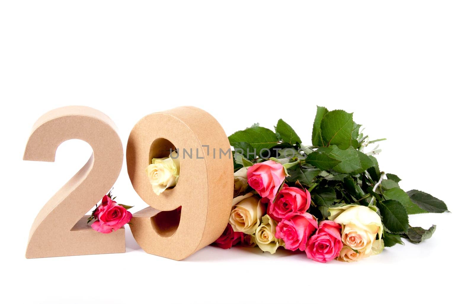 Number of age in a colorful studiosetting,surrounded with roses