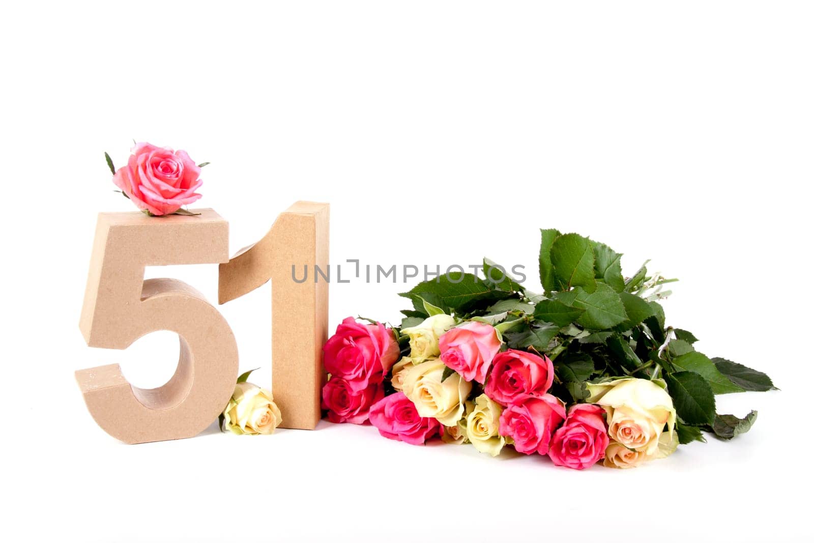 Number of age in a colorful studiosetting,surrounded with roses