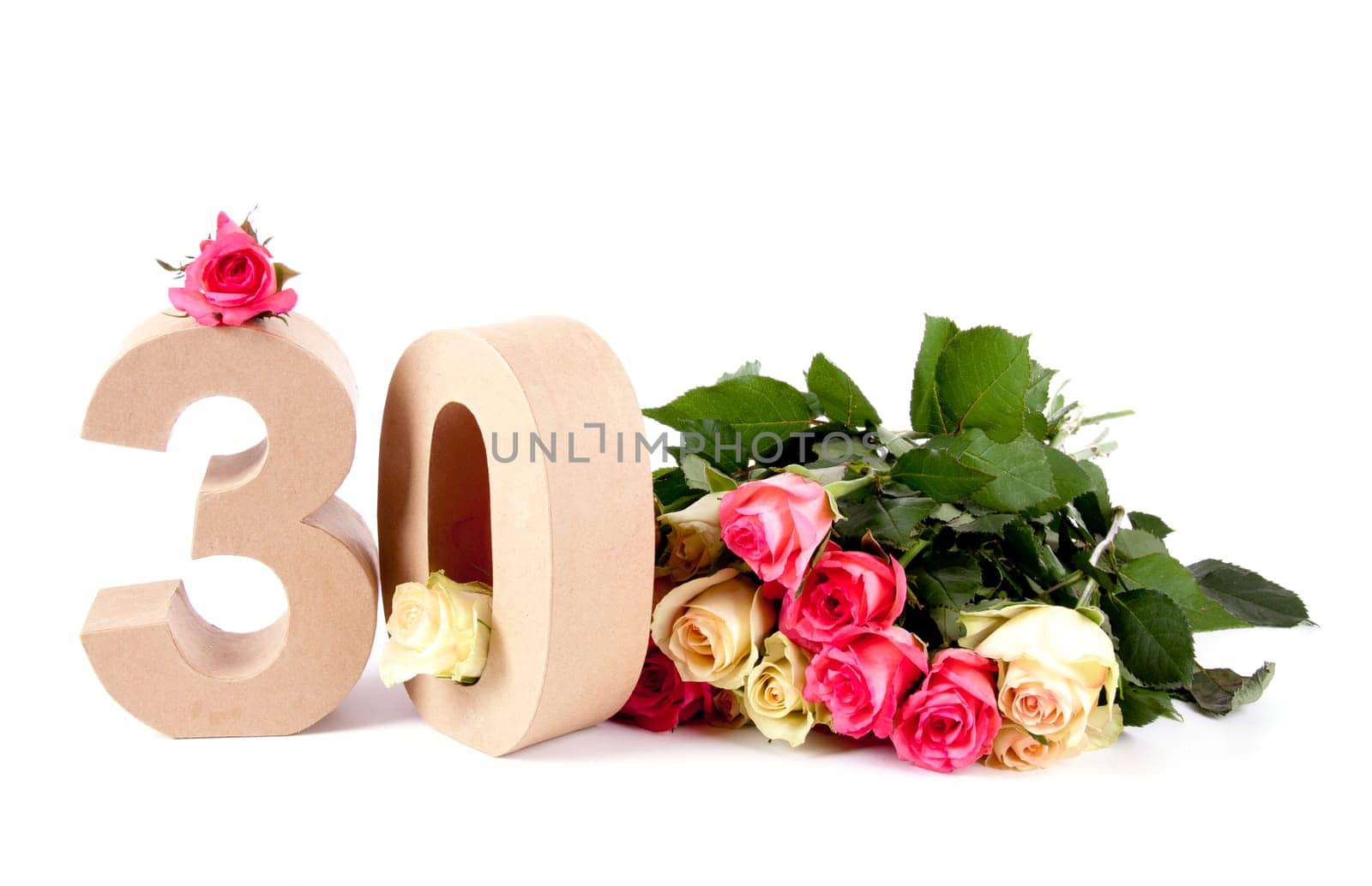 Number of age in a colorful studiosetting,surrounded with roses
