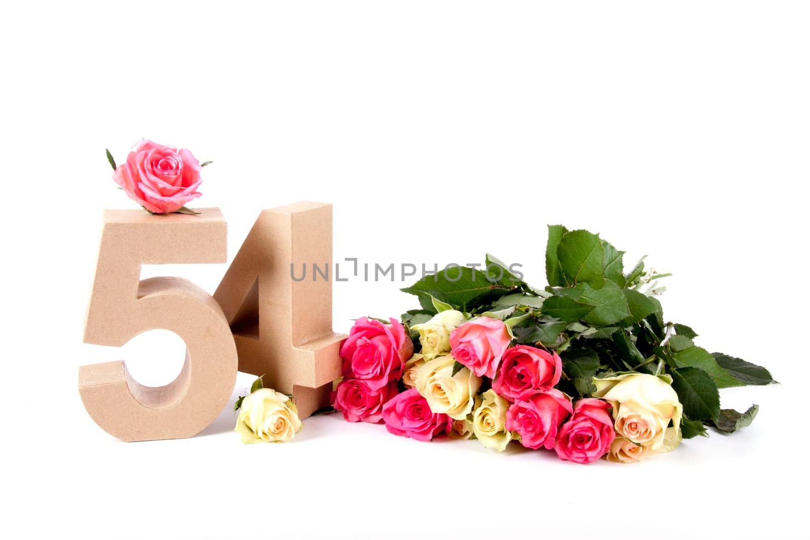 Number of age in a colorful studiosetting,surrounded with roses