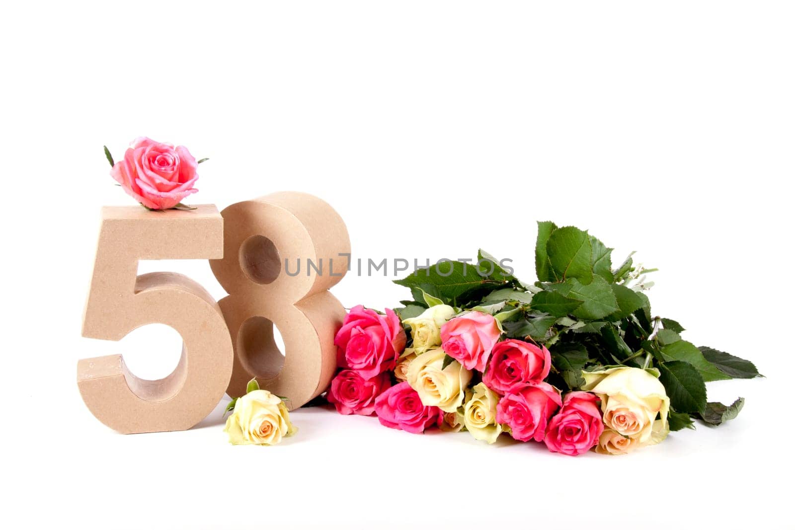 Number of age in a colorful studiosetting,surrounded with roses