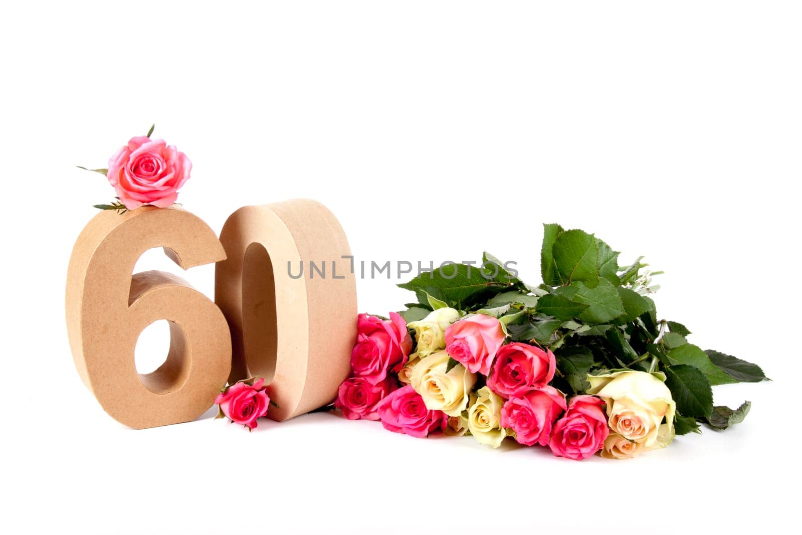 Number of age in a colorful studiosetting,surrounded with roses