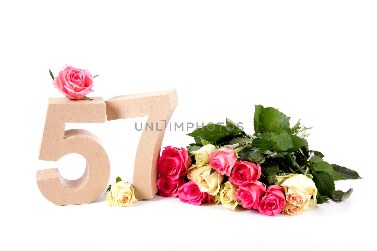Number of age in a colorful studiosetting,surrounded with roses