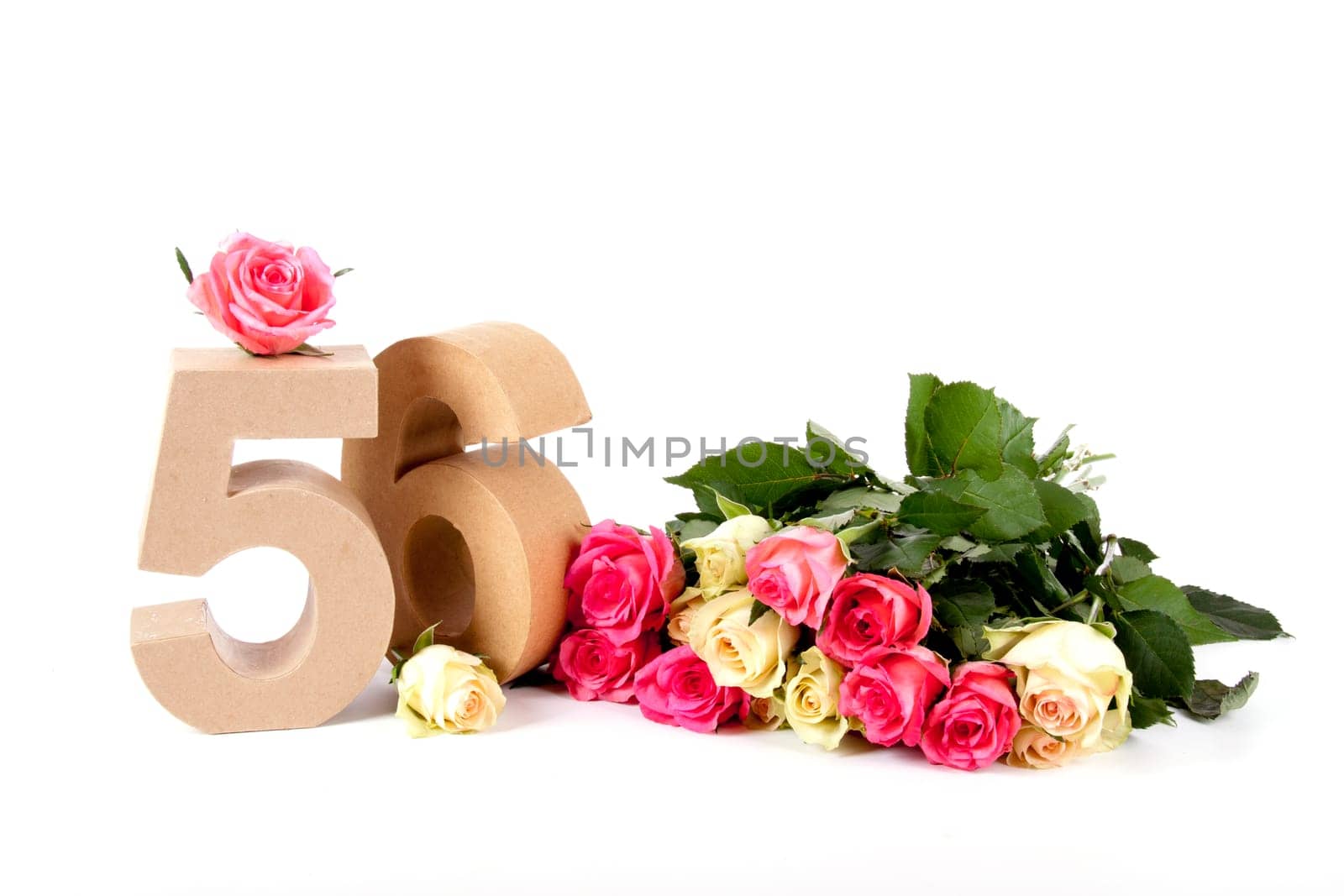 Number of age in a colorful studiosetting,surrounded with roses