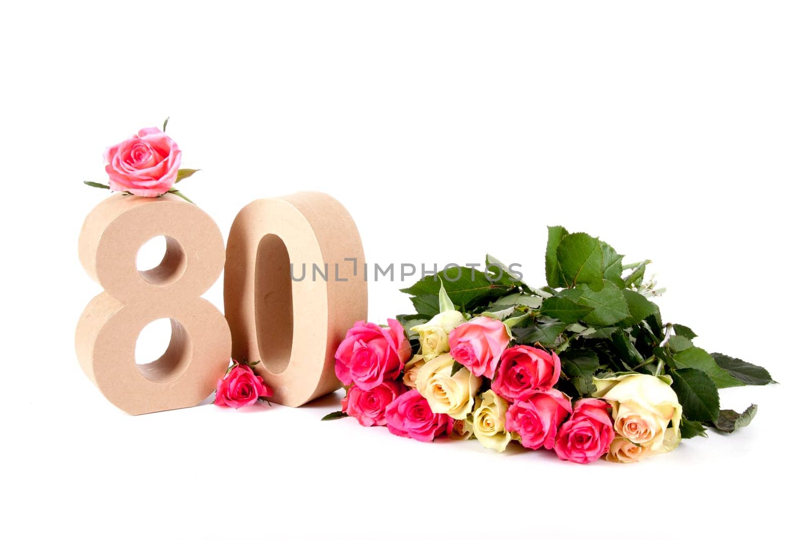 Number of age in a colorful studiosetting,surrounded with roses