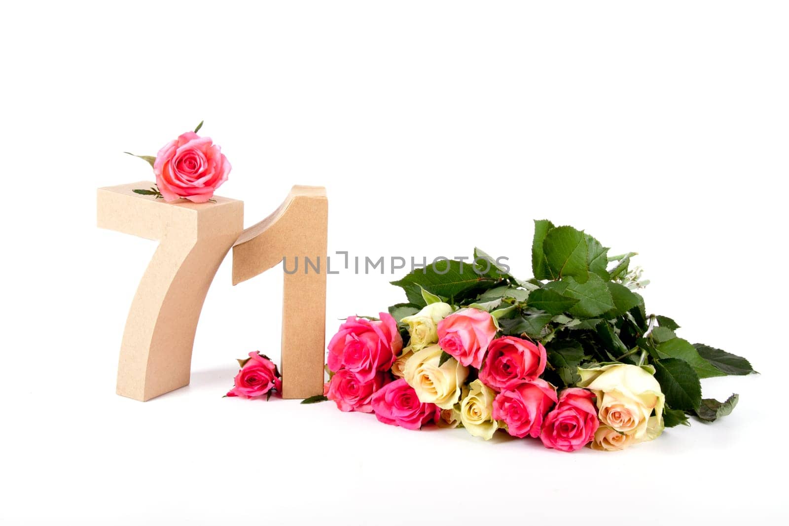 Number of age in a colorful studiosetting,surrounded with roses