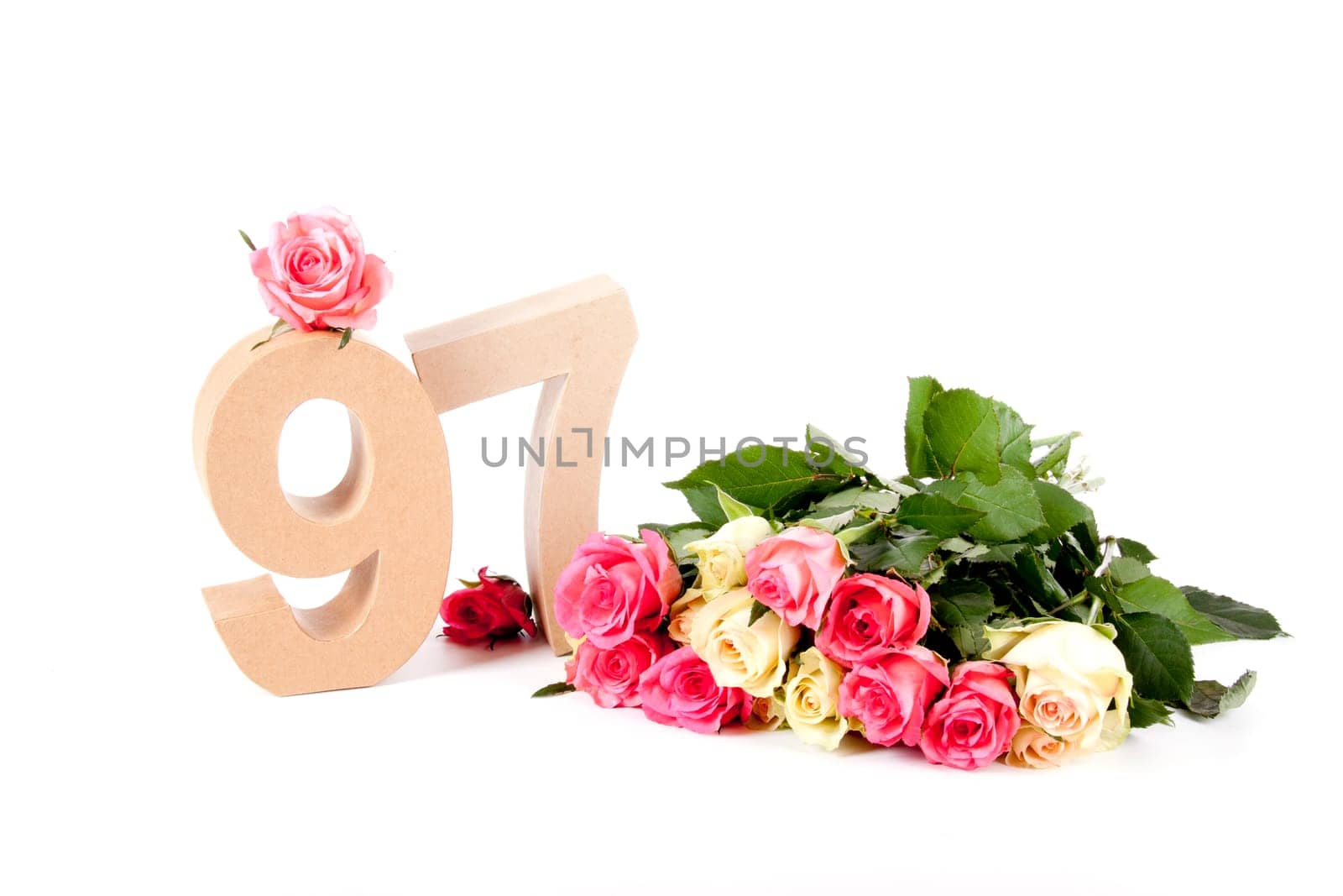 Number of age in a colorful studiosetting,surrounded with roses
