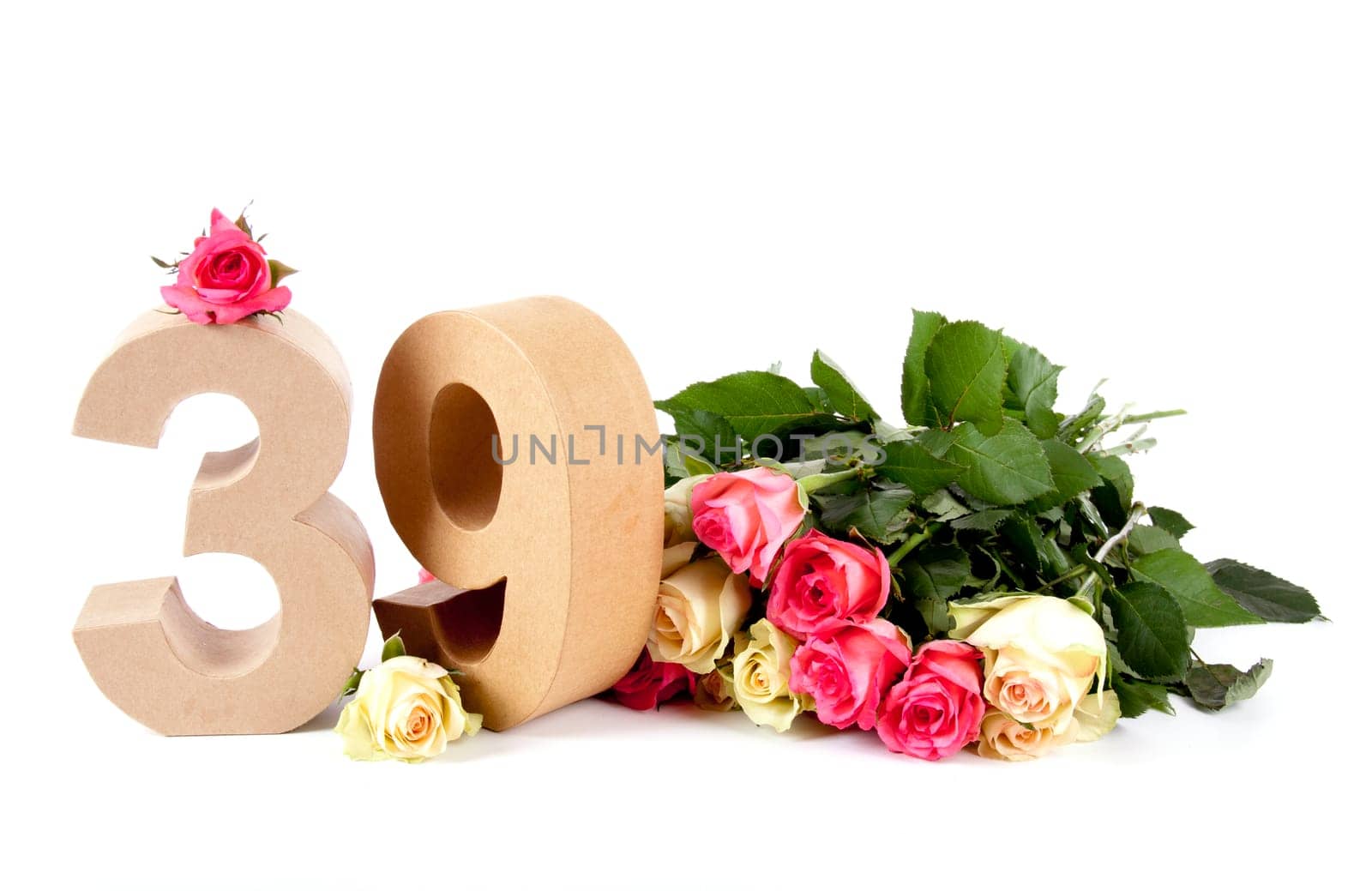 Number of age in a colorful studiosetting,surrounded with roses