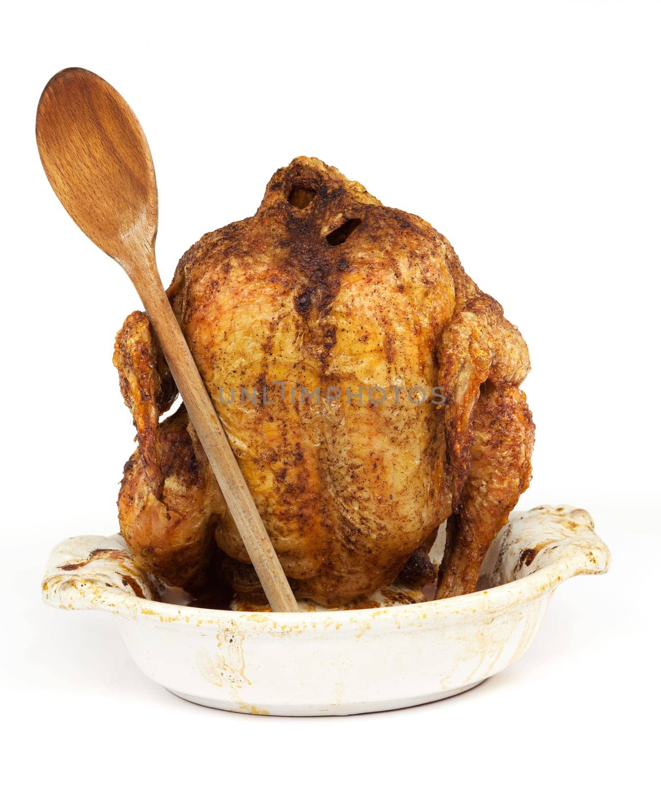 Grilled chicken with wooden spoon,eating in front of white background