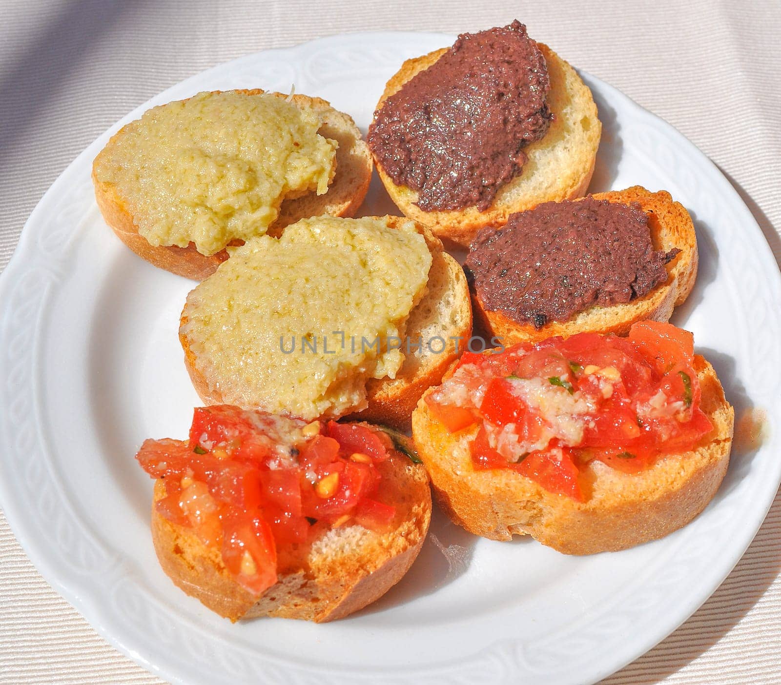 Traditional Italian bruschetta garlic bread with tomato top