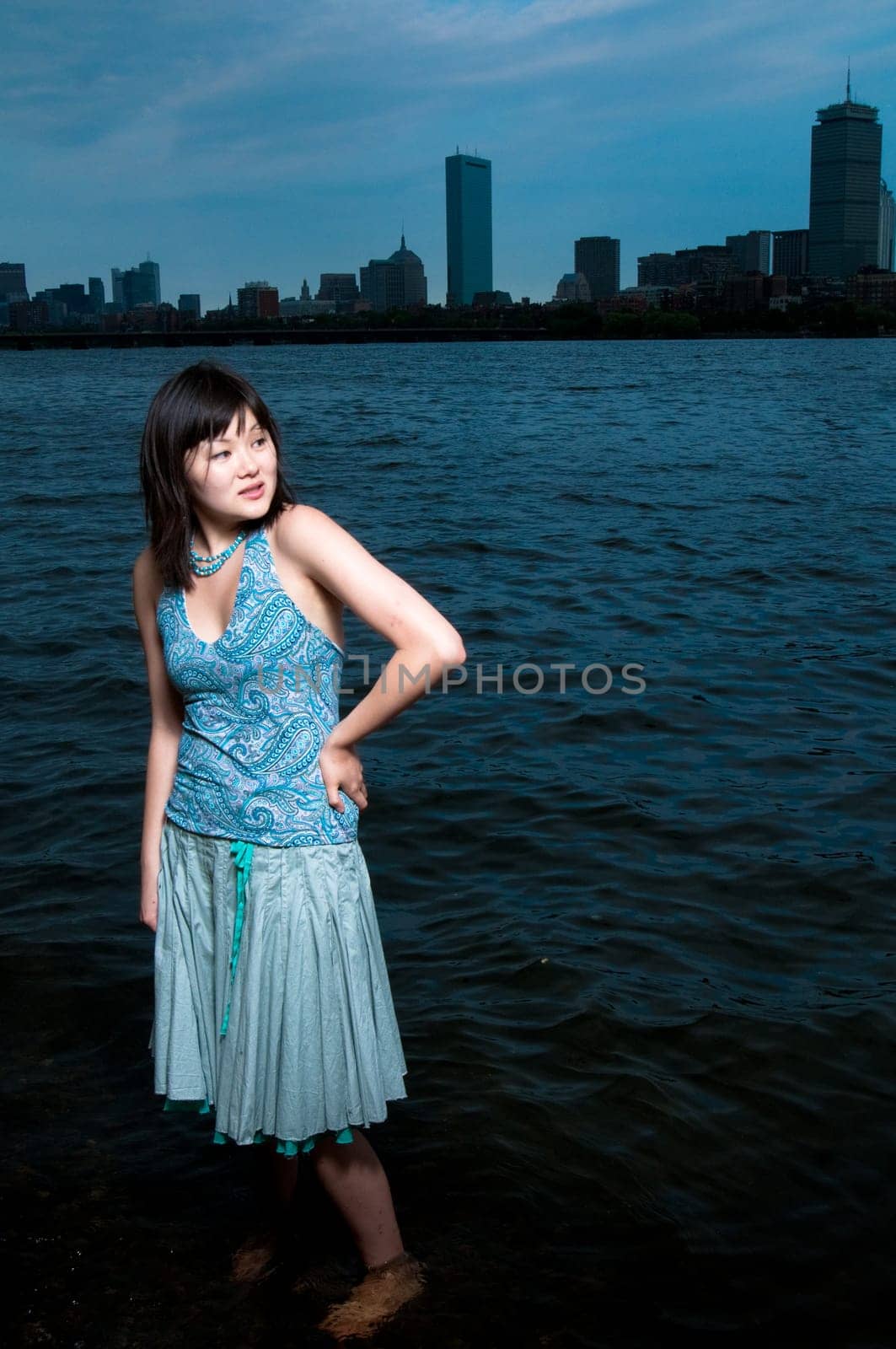 Asian girl at the edge of the Charles River