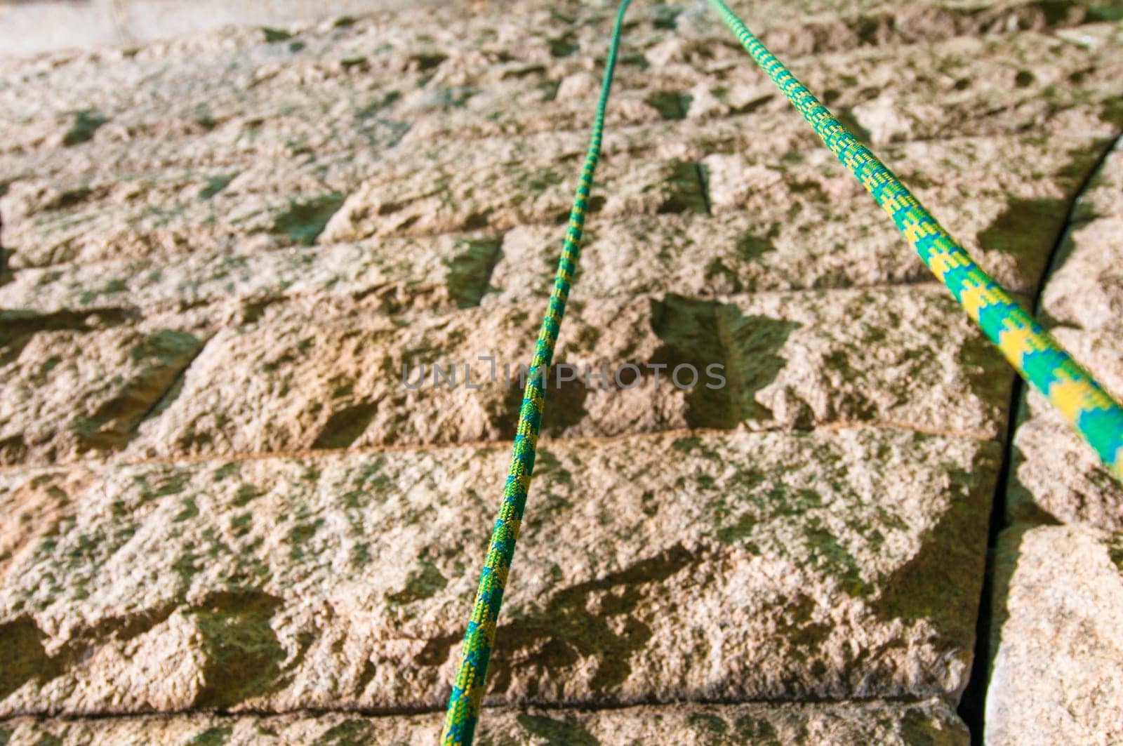 Climbinb rope up close in front of a wall