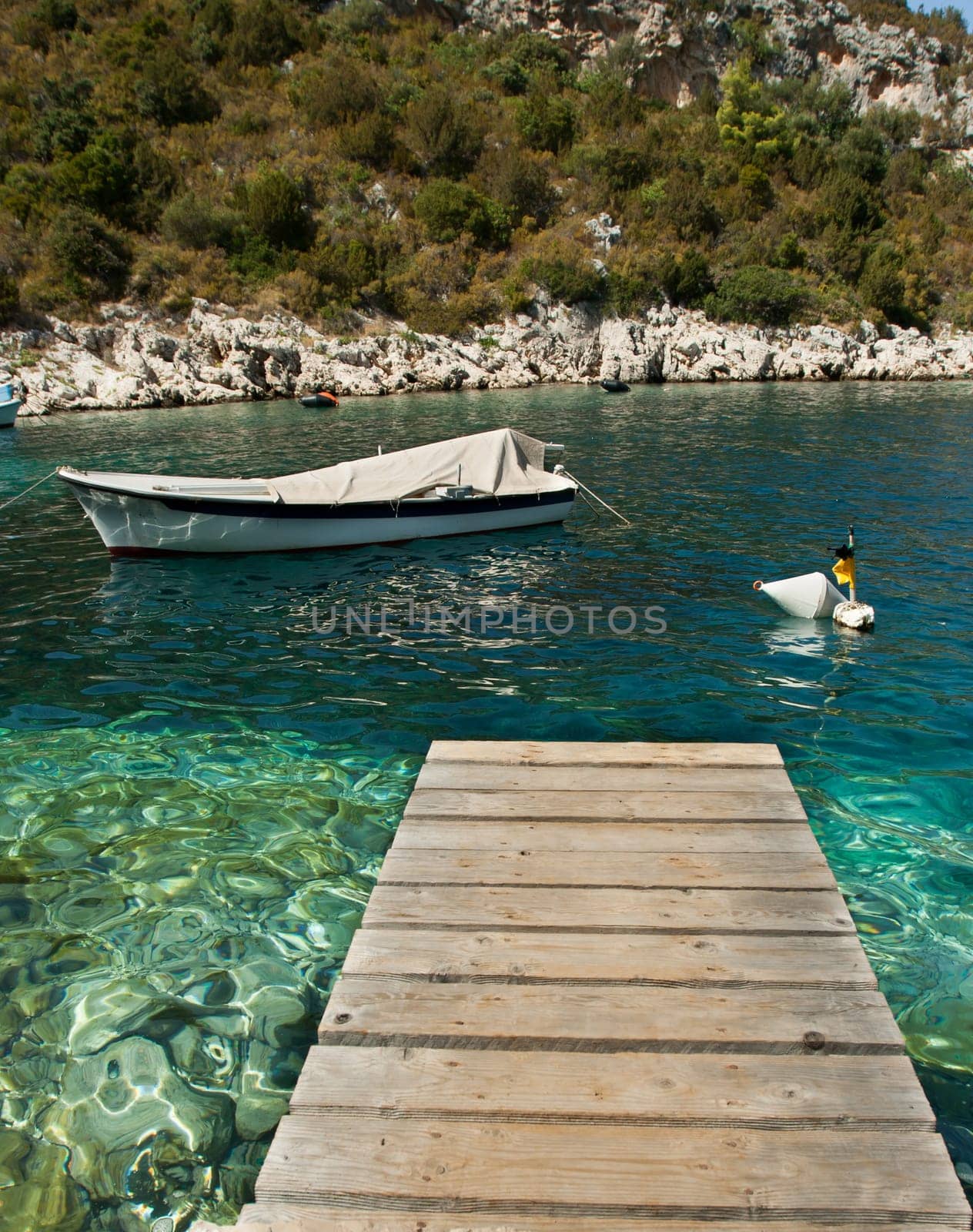 footbridge over the sea with white ship