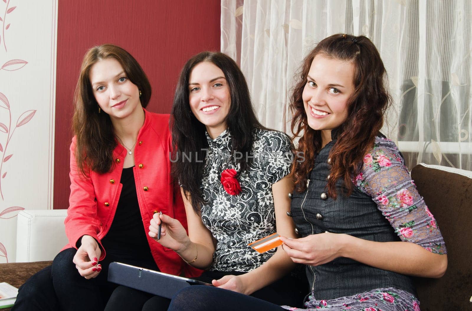 Group beautiful women make purchases on the Internet at home
