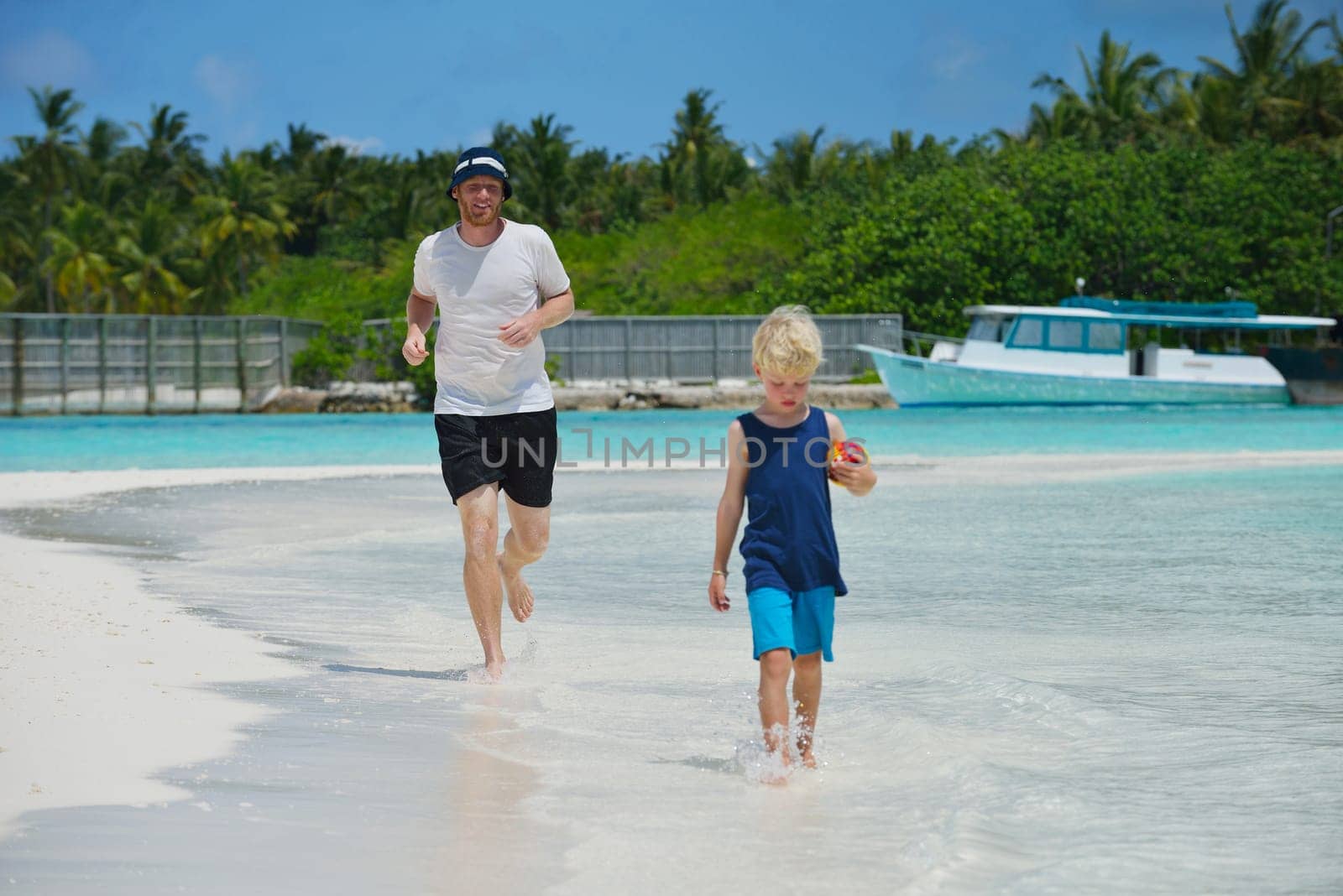 Portrait of a happy family on summer vacation  at beach