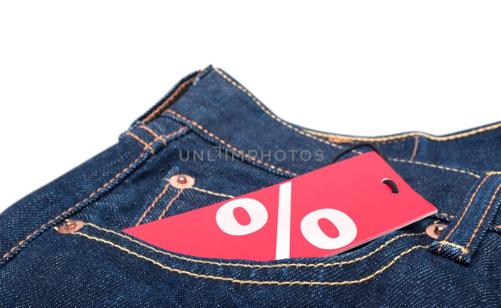 Red Sale Tag With Percentage Symbol in Pocket of Blue Jeans