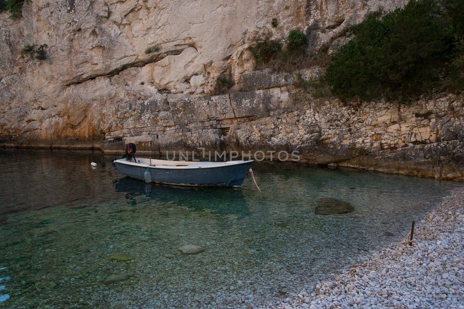White boat on the beach in Stiniva bay