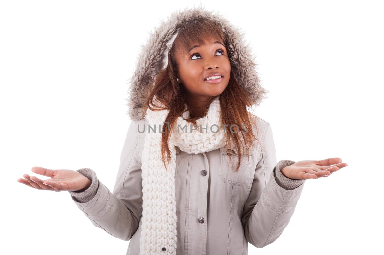 Young african american woman wearing winter clothes holding something in her hand, isolated on white background