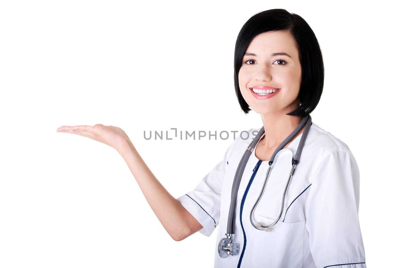 Young medical doctor woman presenting and showing copy space for product or text.