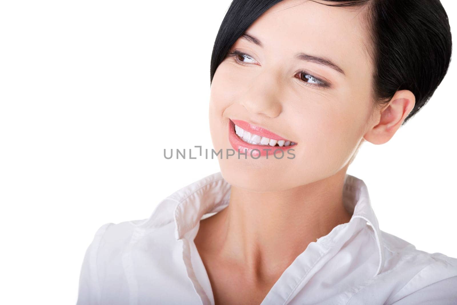 Closeup of a beautiful young businesswoman looking to the side. Isolated on white background