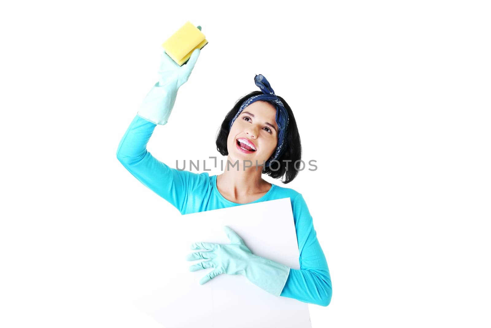 Smiling happy cleaning woman showing blank sign board.