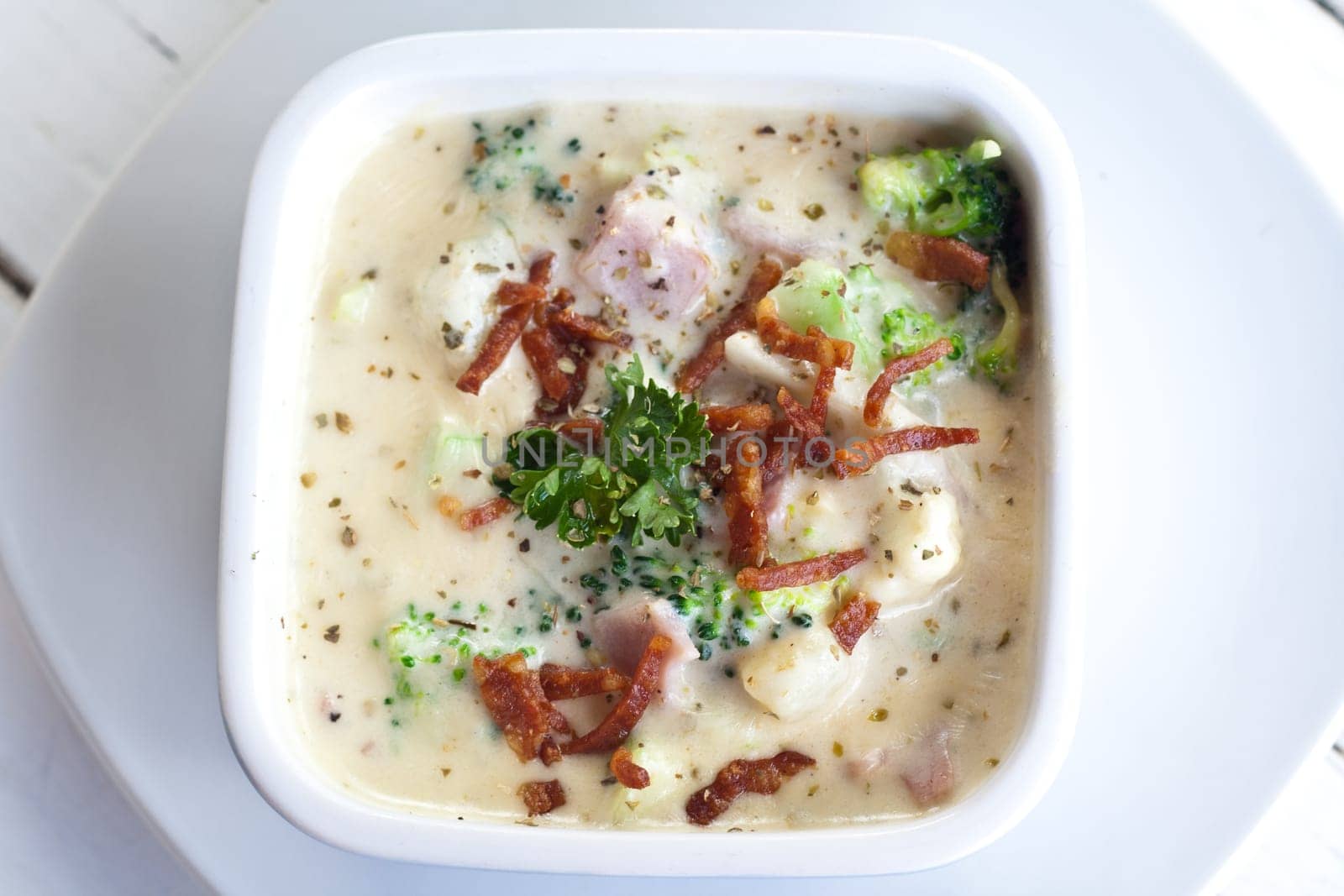 Broccoli, Potato and Bacon baked cheese sprinkle with parsley.