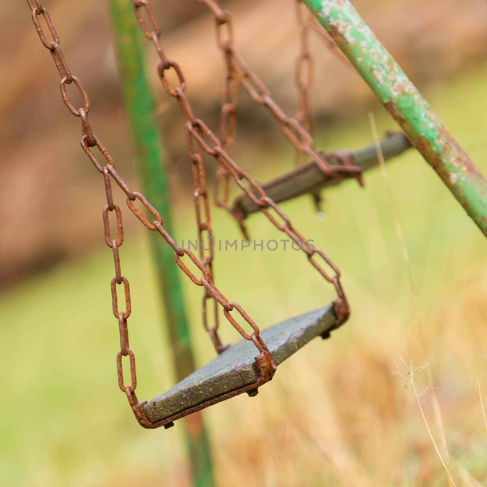 Closeup of swings in a children play area at park