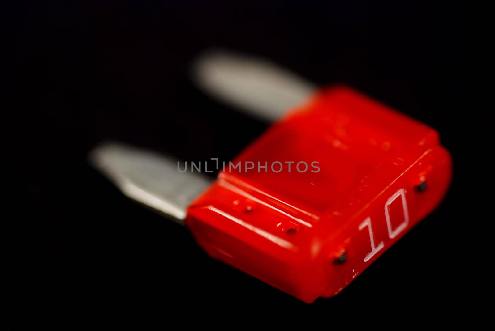 electrical automobile fuses with shallow depth of field on black background