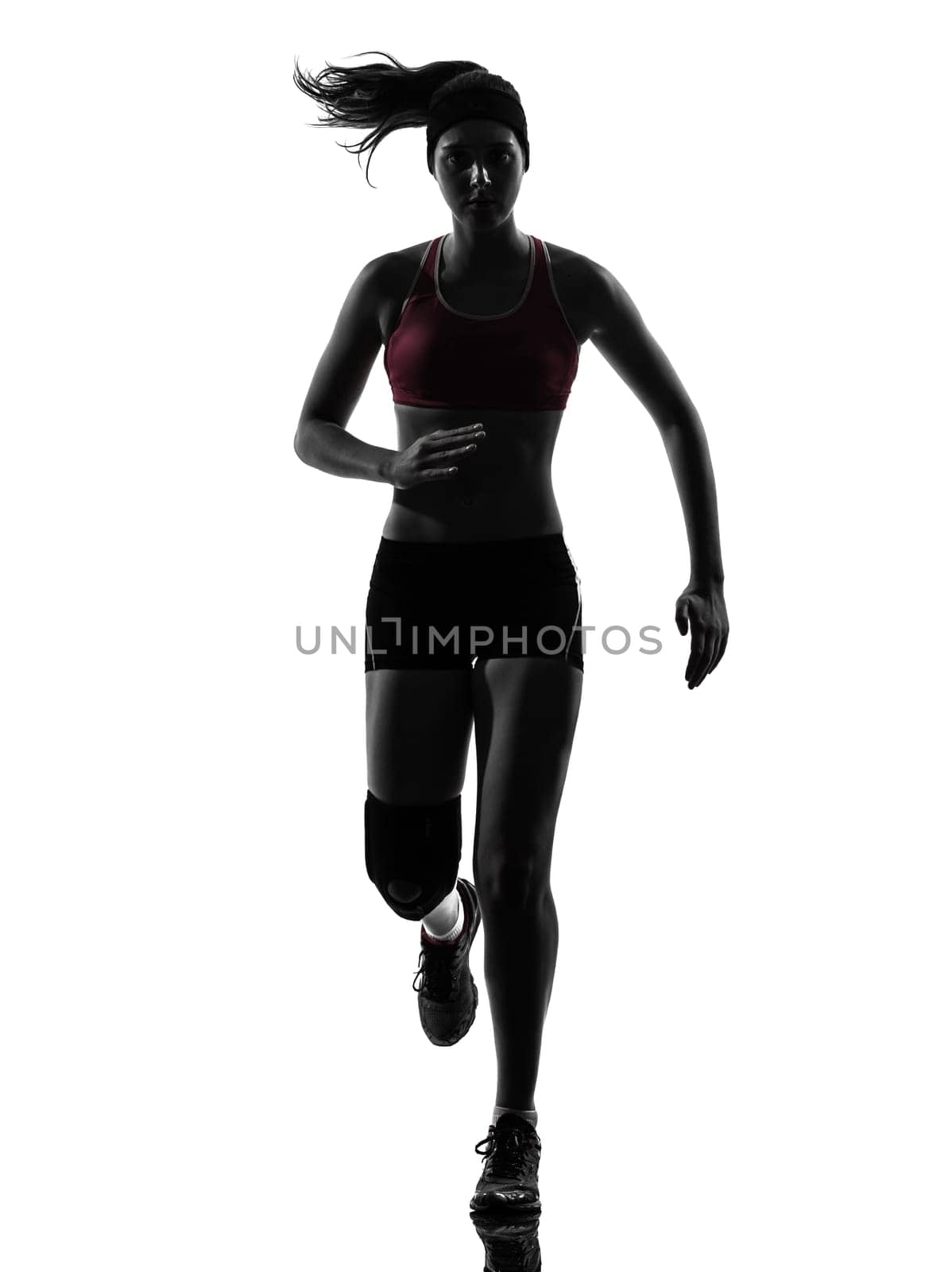 one causasian woman runner running trekking  in silhouette studio isolated on white background