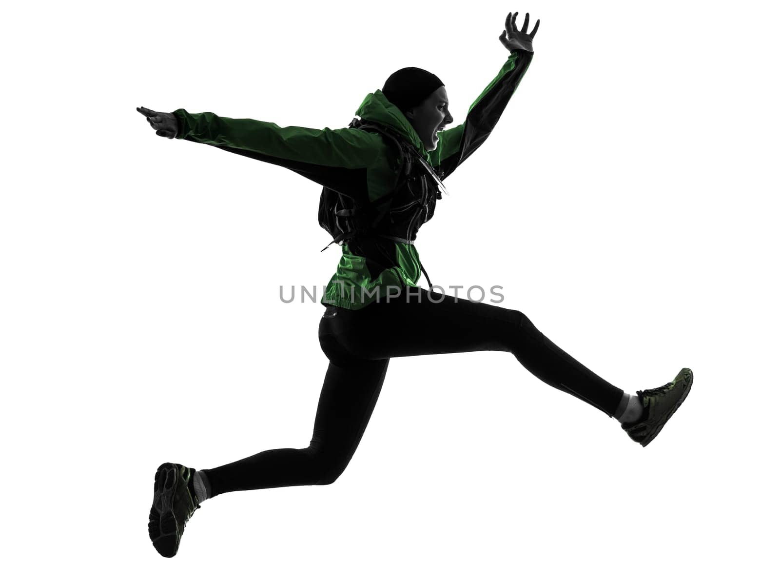 one causasian woman runner running trekking  in silhouette studio isolated on white background