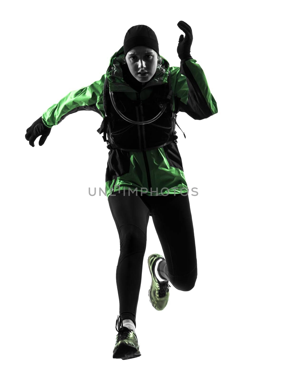 one causasian woman runner running trekking  in silhouette studio isolated on white background