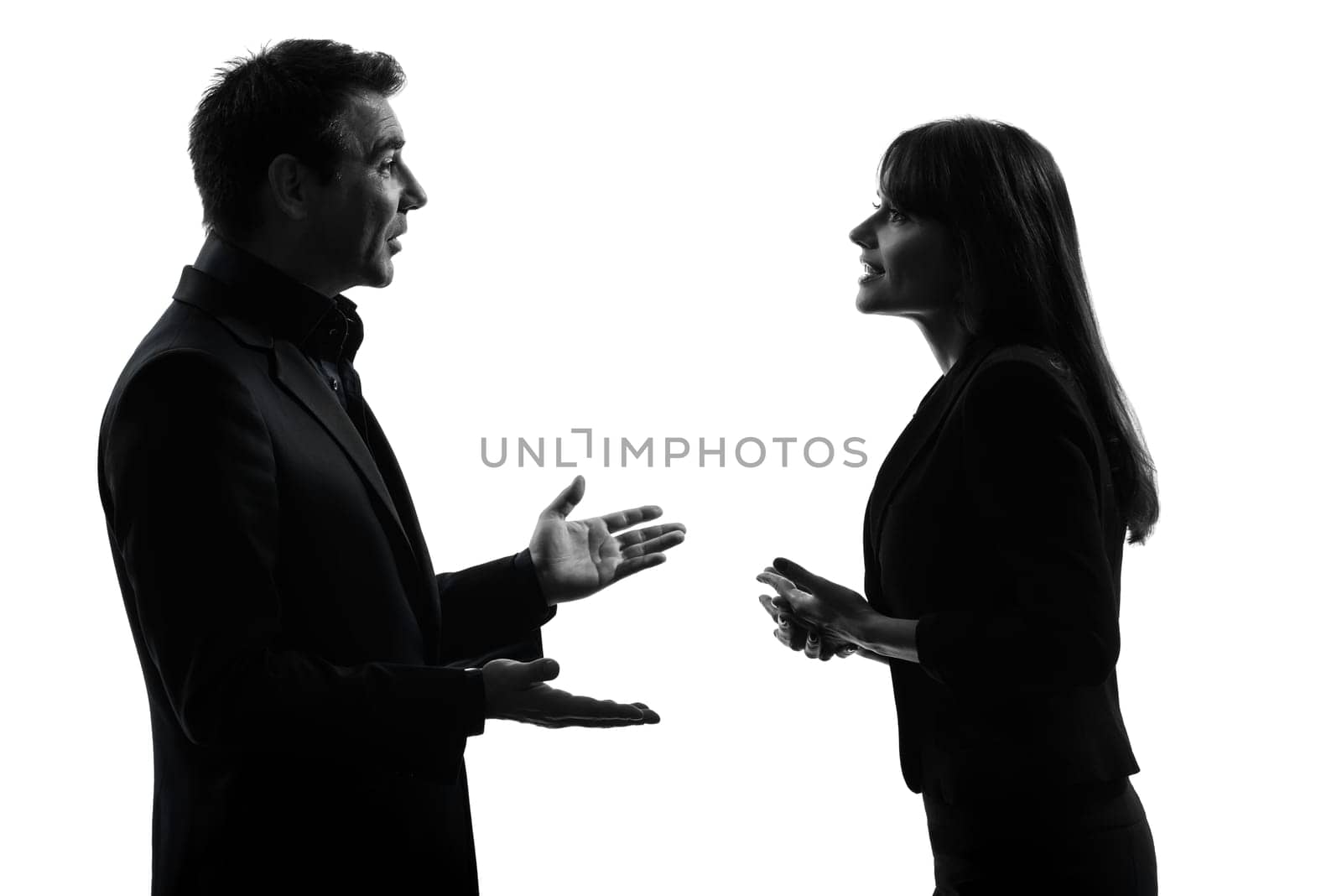 one caucasian couple business woman man in silhouette studio isolated on white background
