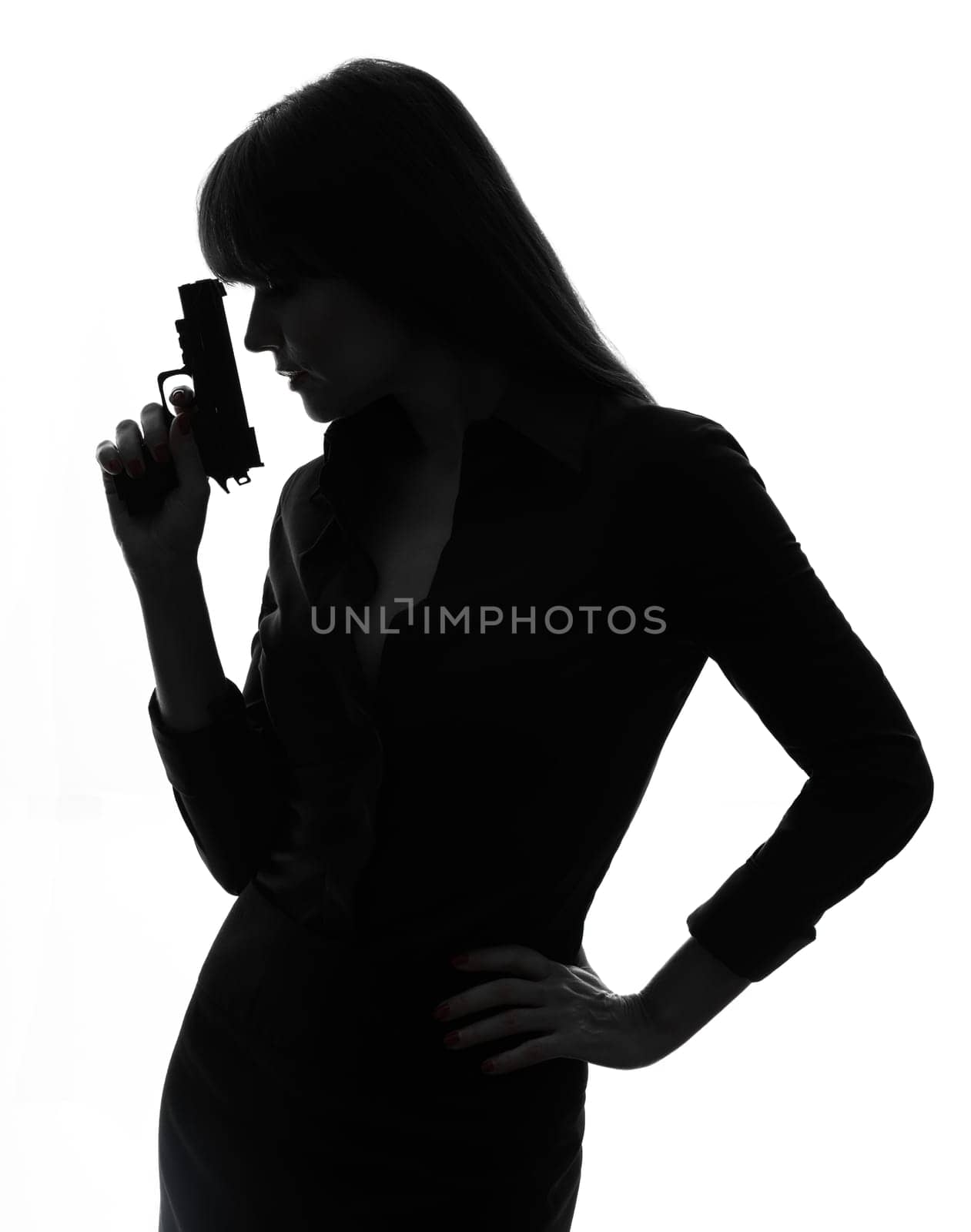 one caucasian sexy detective  woman holding aiming  gun in silhouette studio isolated on white background