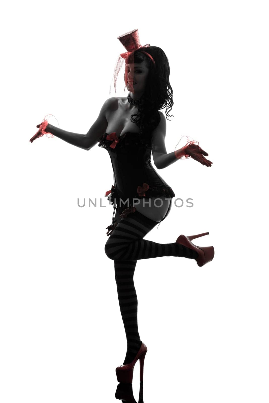 one caucasian woman stripper showgirl portrait  in silhouette studio isolated on white background