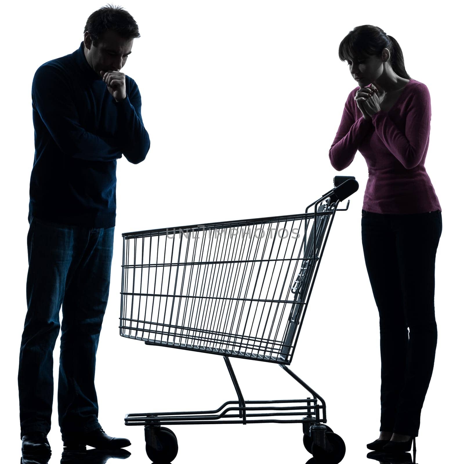 one caucasian couple woman man sad with empty shopping with shopping cart  in silhouette studio isolated on white background