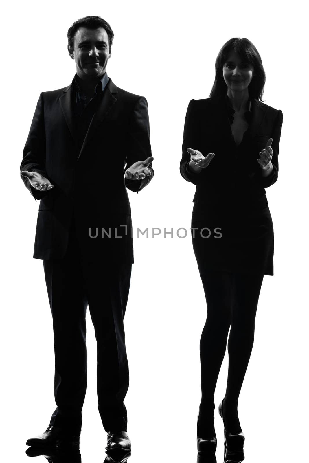 one caucasian couple business woman man in silhouette studio isolated on white background