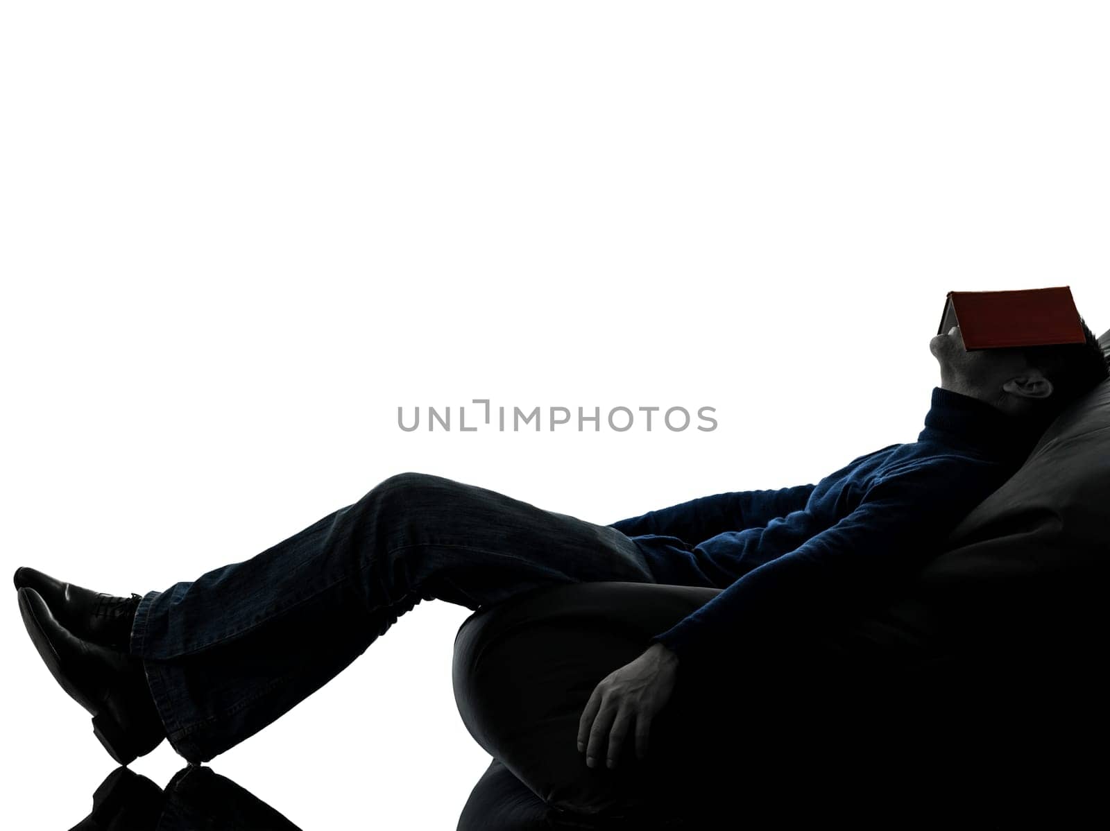 one causasian man reading book full length in silhouette studio isolated on white background