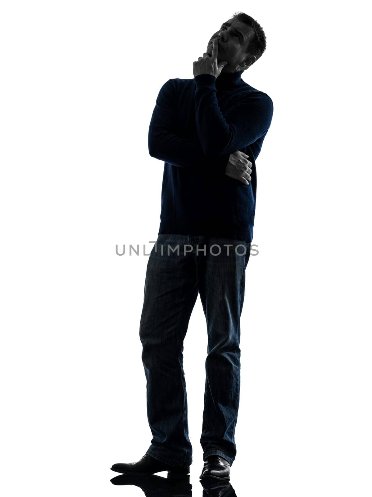 one causasian man full length in silhouette studio isolated on white background