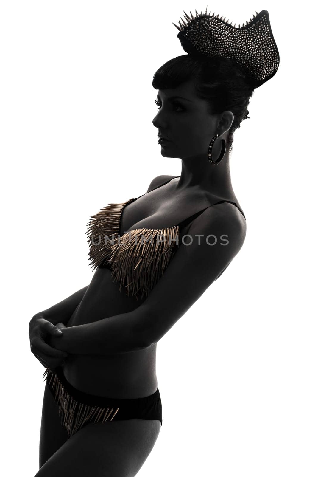 one caucasian woman harlequin circus dancer performer  in silhouette studio isolated on white background