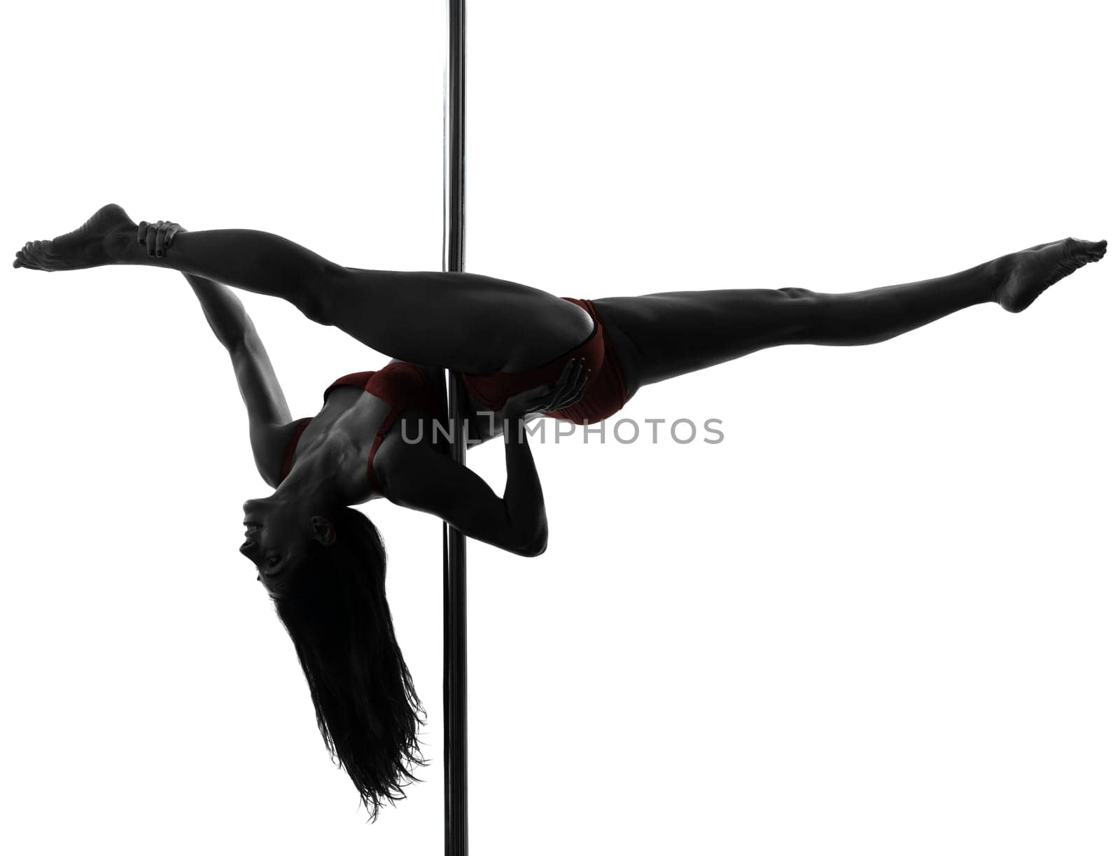 one caucasian woman pole dancer dancing in silhouette studio isolated on white background