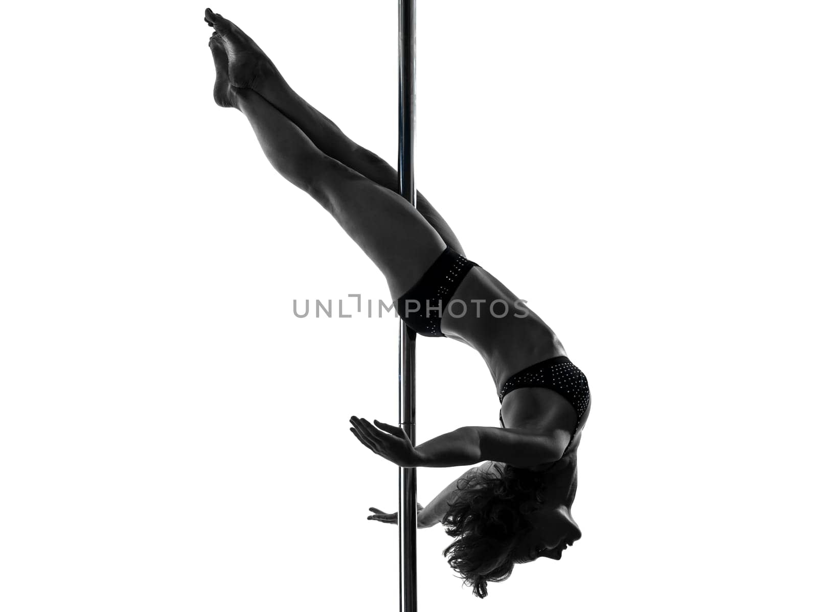 one caucasian woman pole dancer dancing in silhouette studio isolated on white background
