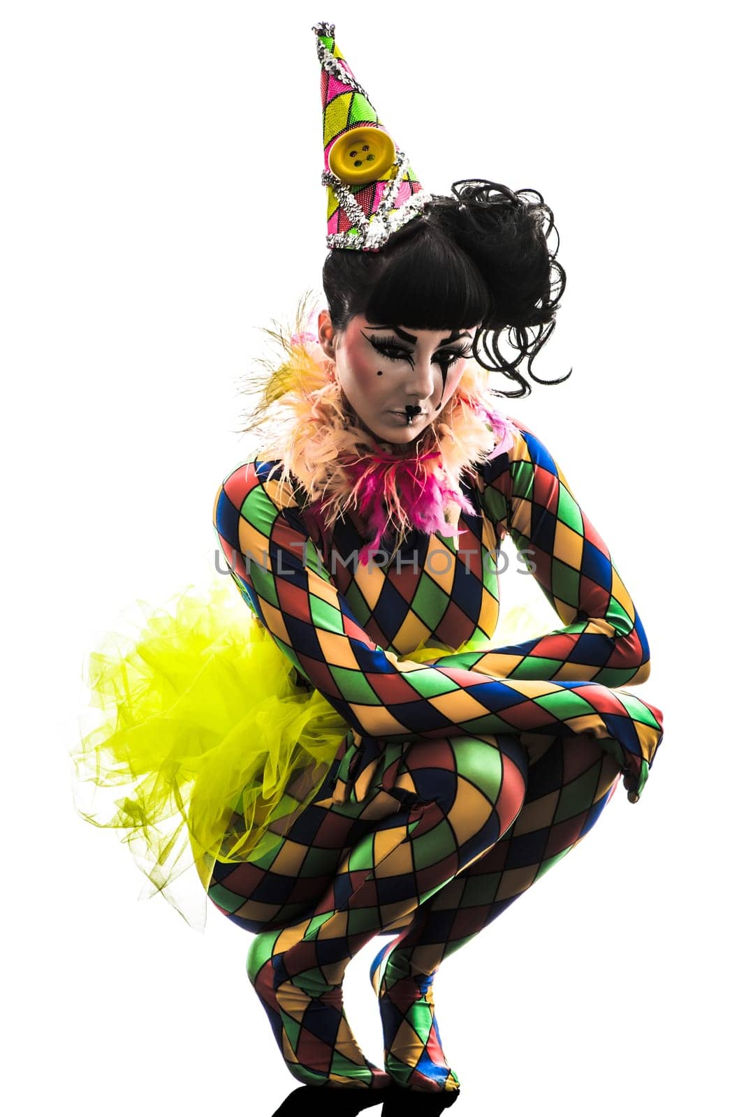 one caucasian woman harlequin circus dancer performer  in silhouette studio isolated on white background