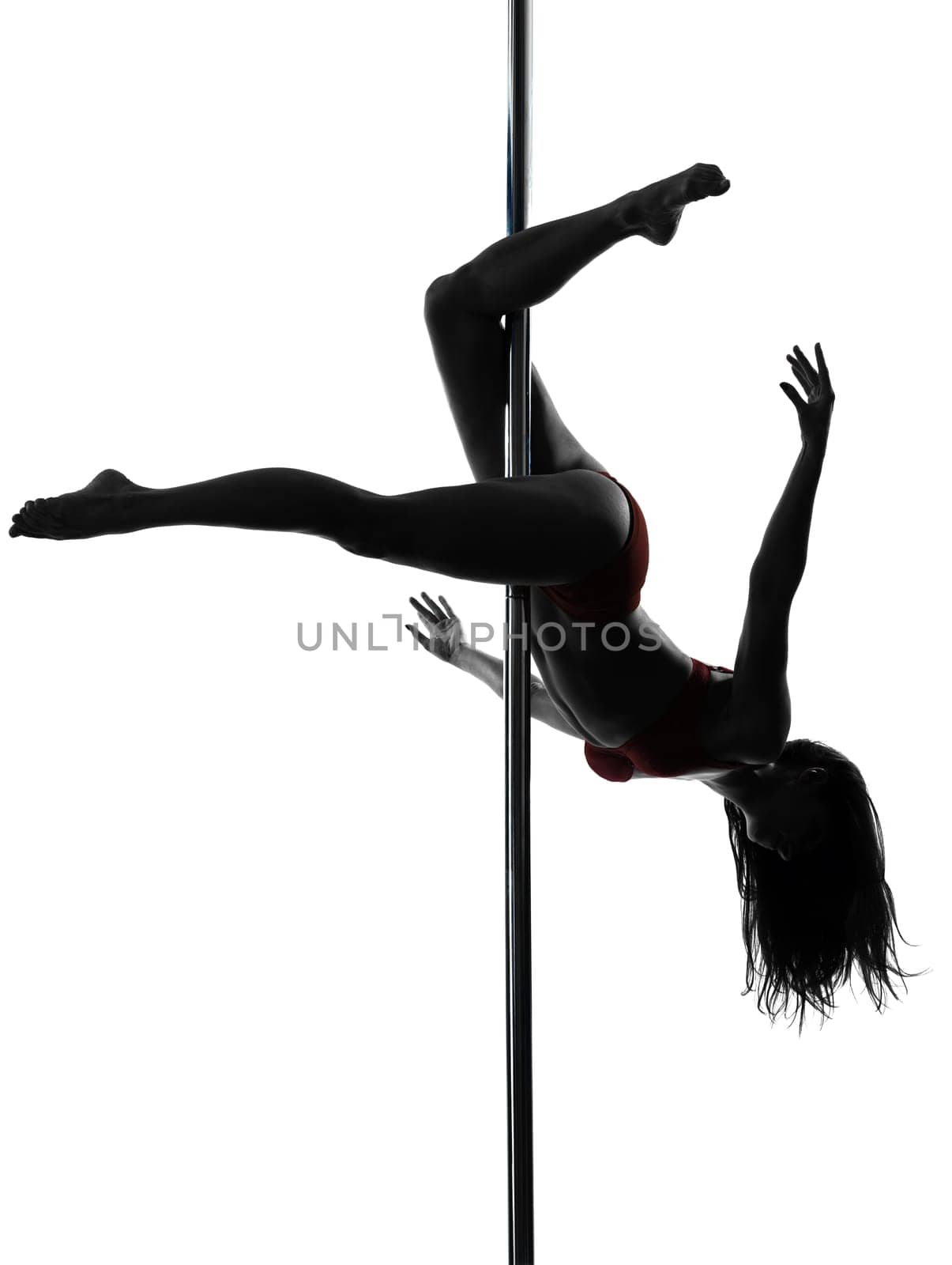 one caucasian woman pole dancer dancing in silhouette studio isolated on white background