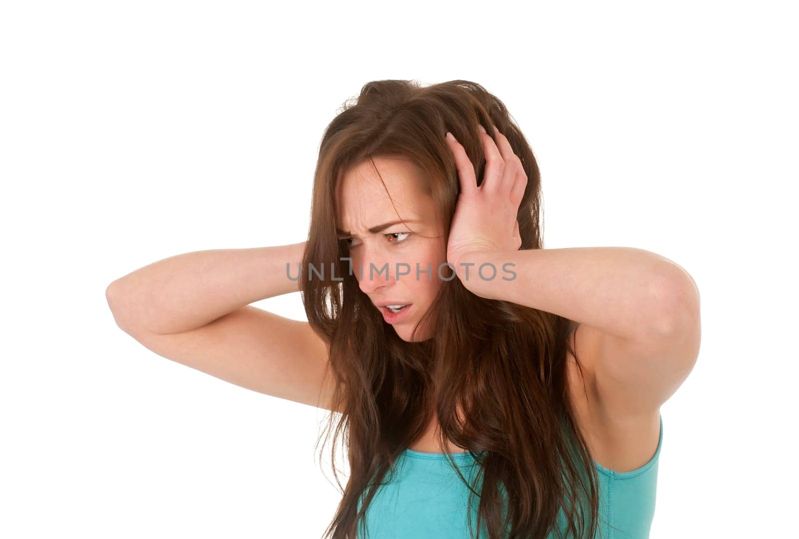 young woman covers her ears